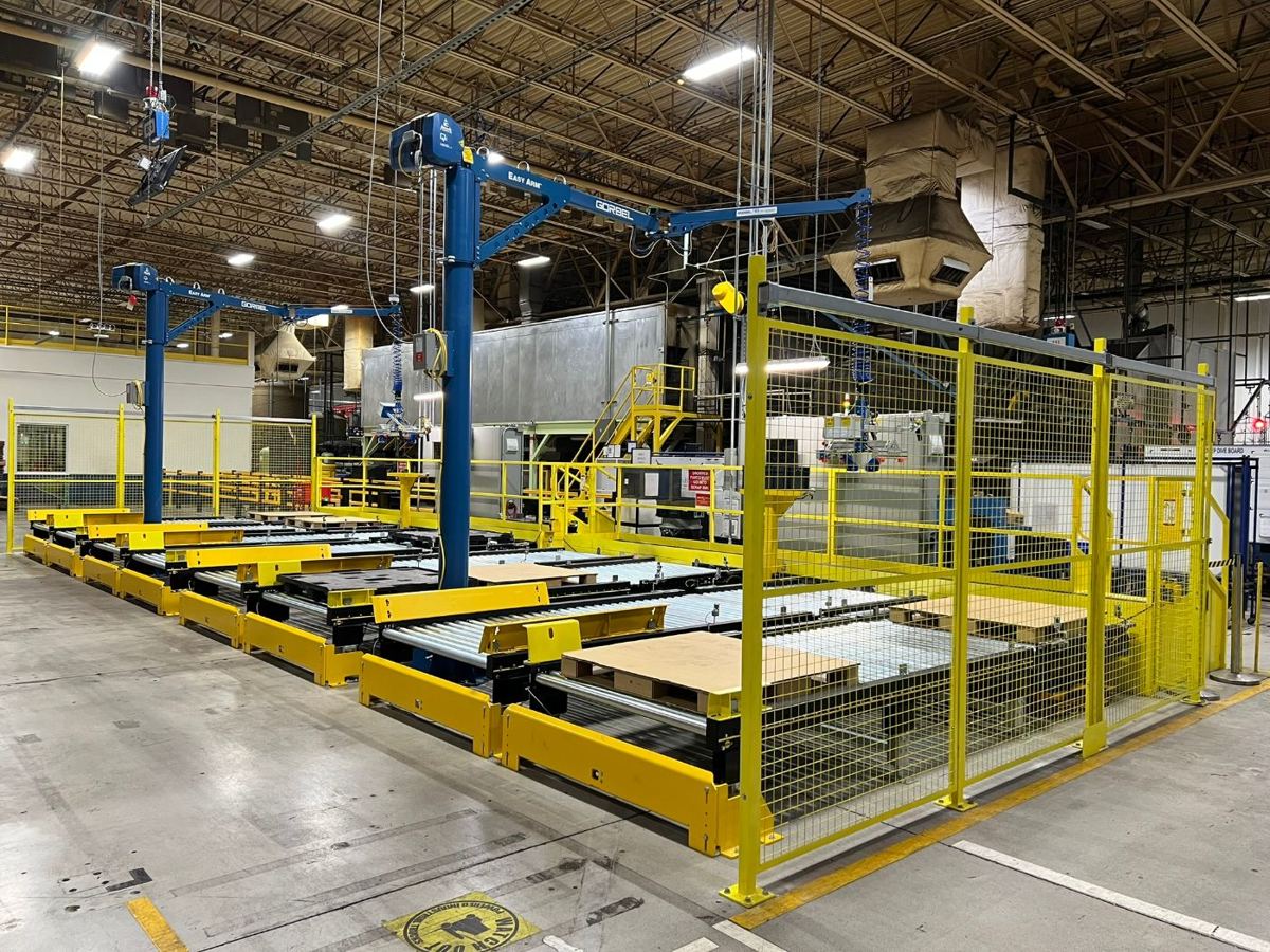 Guarded repack cell with pallet conveyors and lifts
